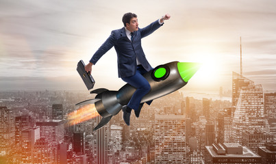 Male businessman flying on rocket in business concept
