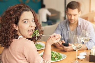Nice looking couple in cafe