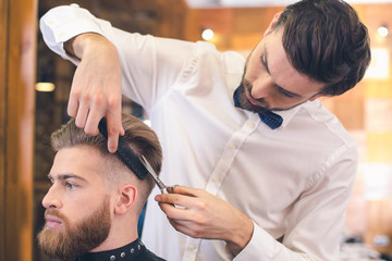 Young Man in Barber Shop Hair Care Service Concept