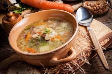 Pea soup with vegetables and bacon.