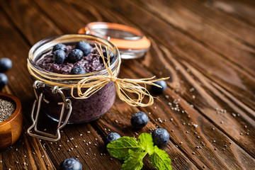 Healthy chia seeds pudding with blueberry, almond milk and honey