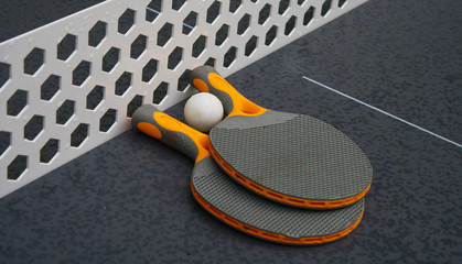 table tennis in the city. two rackets and ball