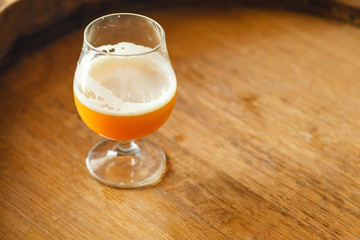 Wheat ale on a wooden barrel