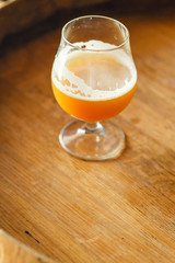 Wheat ale on a wooden barrel