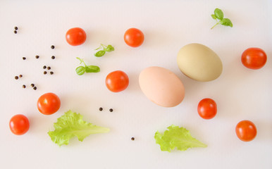 Fresh organic free range eggs with cherry tomatoes. Food design isolated on white background. 