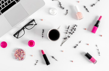 glasses, laptop and cosmetics on white woman table background top view
