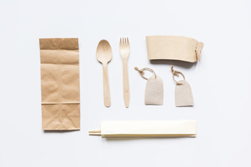 breakfast take away with paper bags on white table background top view mock up