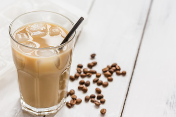 Ice coffee with milk and beans for lunch on white background