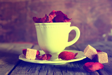 toned photo tea cup with sugar cubes