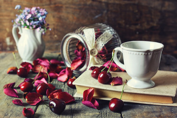 Fototapeta na wymiar vintage composition cherry berry on wooden background