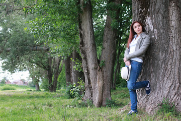 Naklejka na ściany i meble woman in tree park outdoor