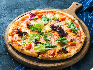 Pizza with herbs and tomatoes