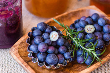 Homemade jam from blueberries and oranges, blueberries on a wooden background