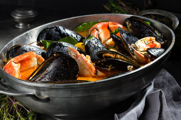 Pot of crabs and mussels soup. Seafood soup