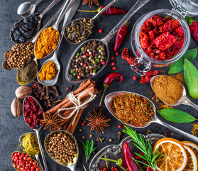 Spices and herbs in metal bowls. Food and cuisine ingredients. Colorful natural additives.
