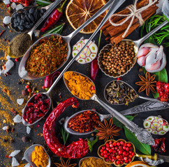 Spices and herbs in metal bowls. Food and cuisine ingredients. Colorful natural additives.