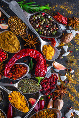 Spices and herbs in metal bowls. Food and cuisine ingredients. Colorful natural additives.