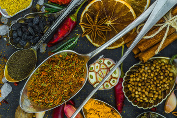 Spices and herbs in metal bowls. Food and cuisine ingredients. Colorful natural additives.