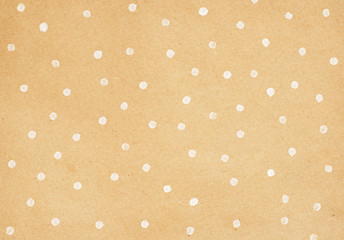 Brown craft paper with polka dot painting