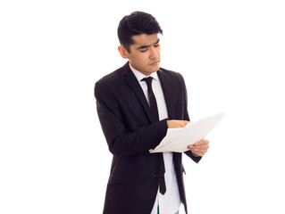 Young man in suit holding papers