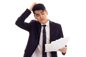 Young man in suit holding papers