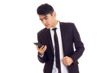 Young man in suit talking on the phone