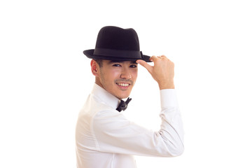 Young man in white T-shirt with black hat