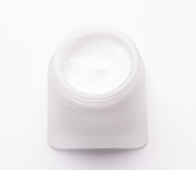 cosmetic cream assortment in glass jar on white background.