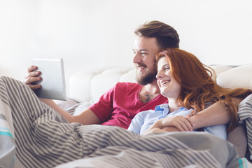 Young couple using tablet.