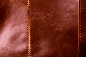 seams on leather hand bag