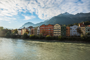 Fototapeta na wymiar Multicolored houses at shore of river Inn at Innsbruck, Austria