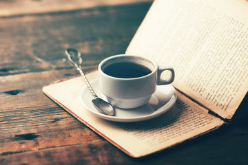 coffee cup on open book