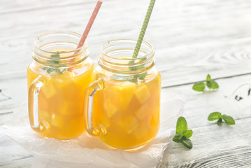 Mango juice in mason jars