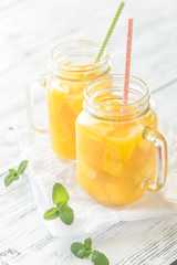 Mango juice in mason jars