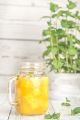 Mango juice in mason jar