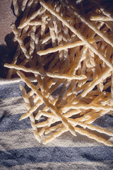 Homemade pasta lying on a wood cutting board
