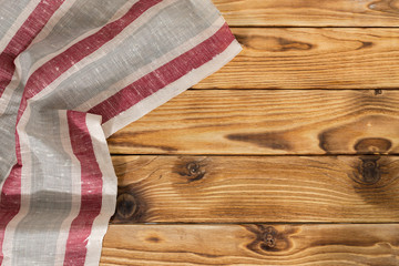 Background with empty wooden table with tablecloth