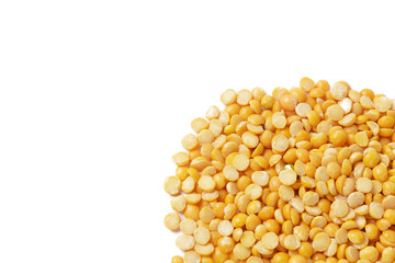 Dry yellow split peas isolated on white.