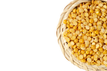 Dry yellow split peas isolated on white.
