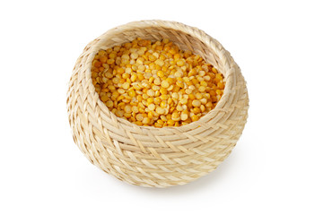 Dry yellow split peas isolated on white.