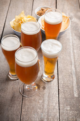 glass beer on wood background