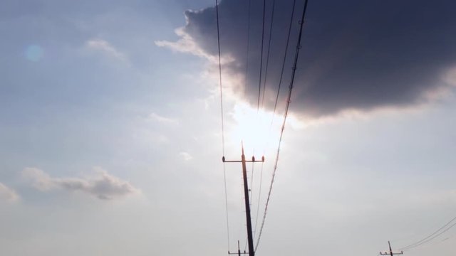 Telegraph wire over the sun