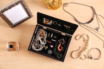 Jewelry accessories in box and table, top view
