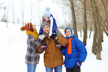 Happy family in winter park