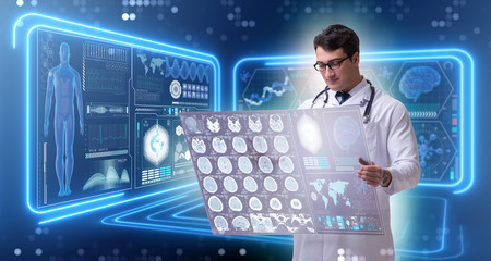 Male doctor studying results of brain mri scan