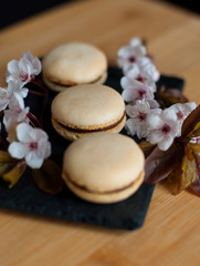 Macaroons decorated with flowers with nice blur