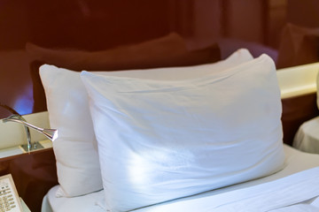 Comfortable pillows and bed .