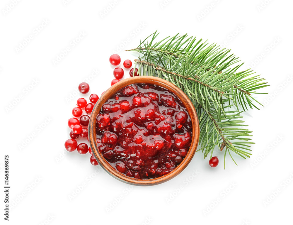 Wall mural delicious cranberry sauce in bowl on white background, top view