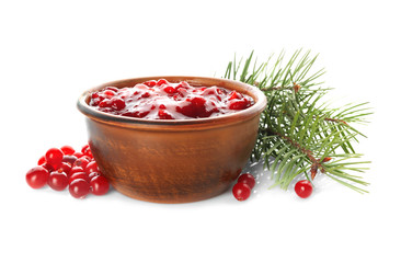 Delicious cranberry sauce in bowl on white background