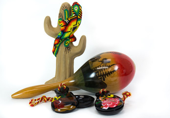 Beaded gecko on ceramic cactus with maraca and castanets